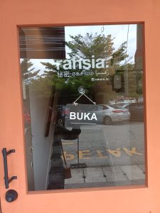 Front door of cafe with signage